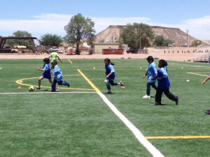 GOS Donation 01 San Filipe Pueblo NM Gear Delivery - Kids Playing Soccer at Indian Pueblo