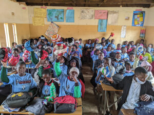 GOS Donation 19 Zambia Gear Delivery - Kids Receiving Soccer Gear in Classroom