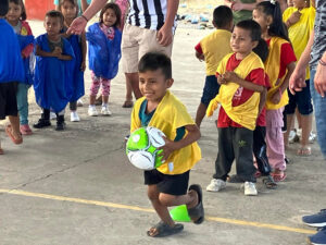 GOS Donation 29 Ecuador Gear Delivery - Kids playing in Pinnies