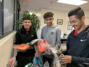 GOS Donation 16 Albuquerque Learning High School Gear Delivery - Young Adults Getting Soccer Gear