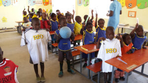 Gift of Soccer Donations Getting to Kids Around the World - Kids getting Gear at Schools in Africa