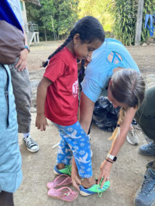 Gift of Soccer Donations Getting to Kids Around the World - Fitting for Shoes