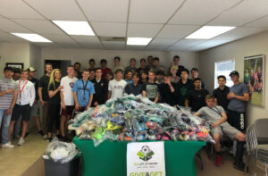 GOS Gear Collection - Rio Rapids Boys Soccer Club Teams cleaned and organized 1,000 pieces of gear with the Gift of Soccer Foundation Team