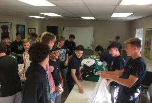 GOS Gear Collection - Rio Rapids Boys Soccer Club Teams cleaned and organized collected gear with the Gift of Soccer Foundation Team