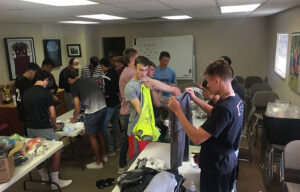 GOS Gear Collection - Rio Rapids Boys Soccer Club Teams cleaned and organized gently used pieces of gear with the Gift of Soccer Foundation Team