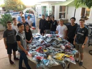 GOS Gear Collection - Rio Rapids Boys Soccer Club Teams cleaned and organized collected gear with the Gift of Soccer Foundation Team