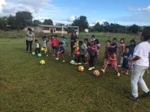 GOS Donation 15 Ecuador Gear Delivery - Kids Playing Soccer on Grass