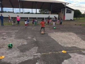 GOS Donation 15 Ecuador Gear Delivery - Kids Playing Soccer on Dirt